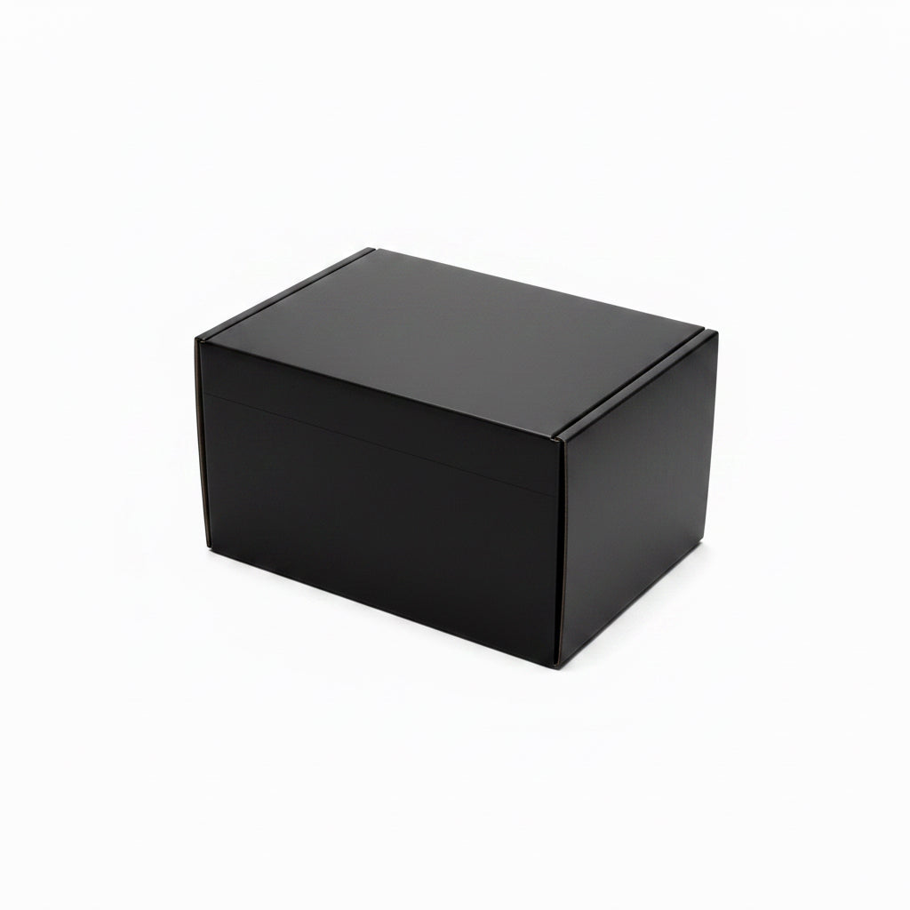 One black cardboard gift boxes on a white background, with one box open showing its interior and the other standing closed beside it.
