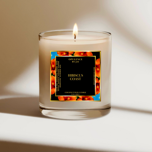 A candle with flame with a Hibiscus flower background on the label