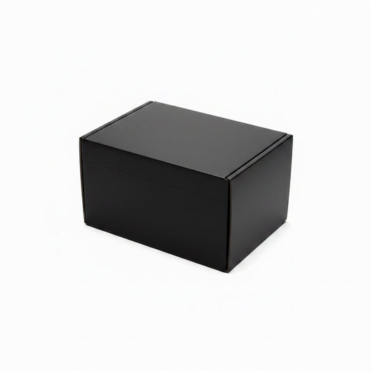 One black cardboard gift boxes on a white background, with one box open showing its interior and the other standing closed beside it.
